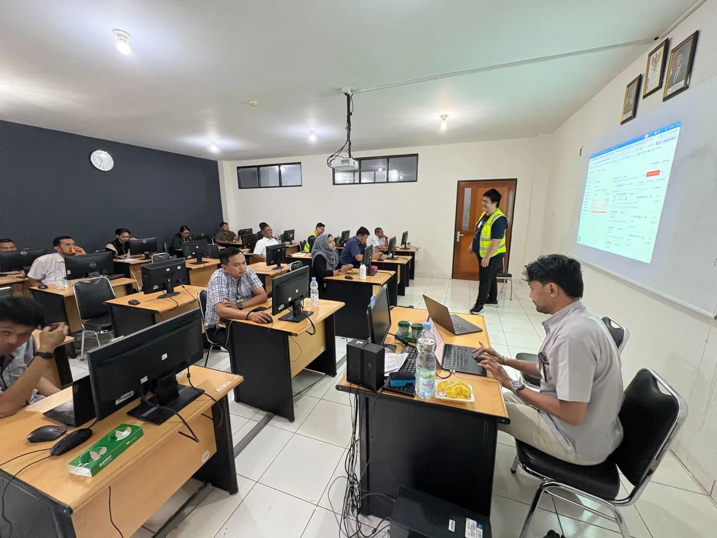 A training session for airline ground staff at rows of terminals